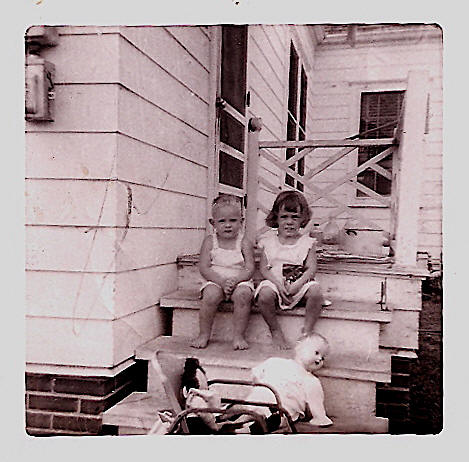 Donnie DeLee and Patricia Chisum in about 1953, sitting on the back porch of his home off of Dryden Road